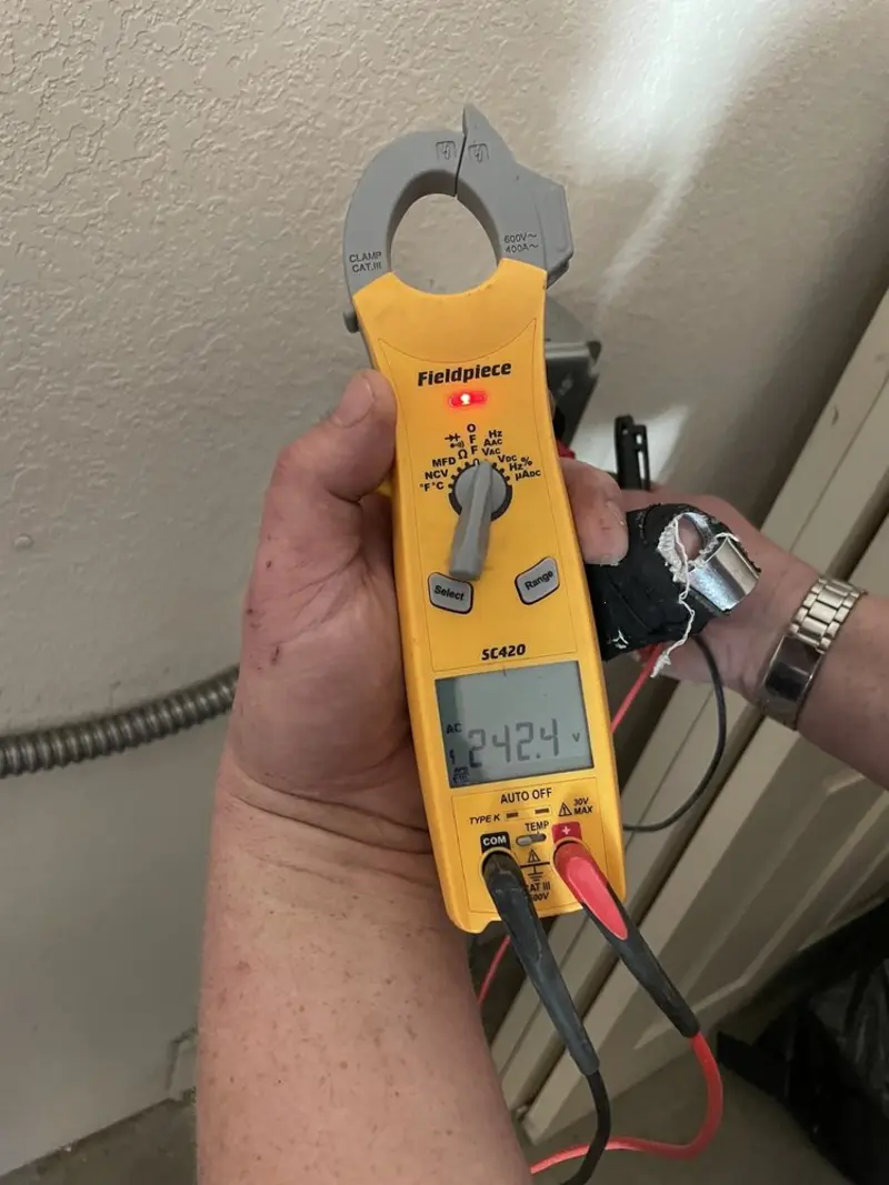 Voltage testing with clamp meter during Whole House Surge Protector in Mountain Home